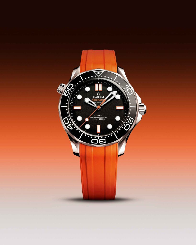 Omega Seamaster Diver 300M features a striking black matte dial paired with a vibrant orange rubber strap