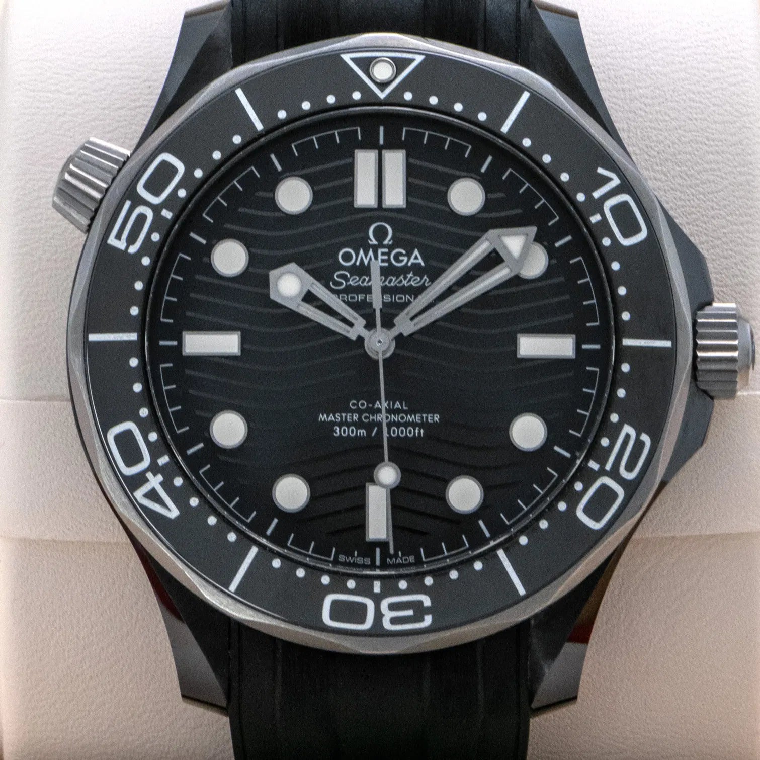 Omega Seamaster Diver 300M Co-Axial Master Chronometer with a black ceramic case and a matching black rubber strap