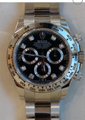Rolex Daytona 116509, featuring a white gold case and a black dial adorned with diamond hour markers