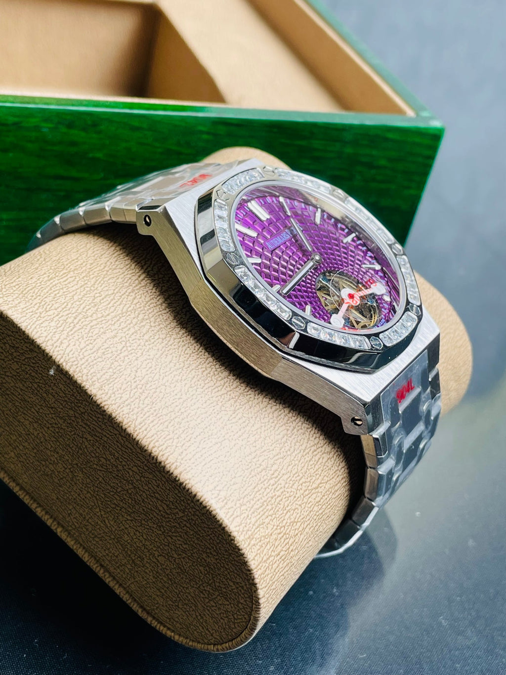Audemars Piguet Royal Oak Selfwinding Flying Tourbillon features a purple "Plum" dial with a distinct sunburst tapisserie pattern.