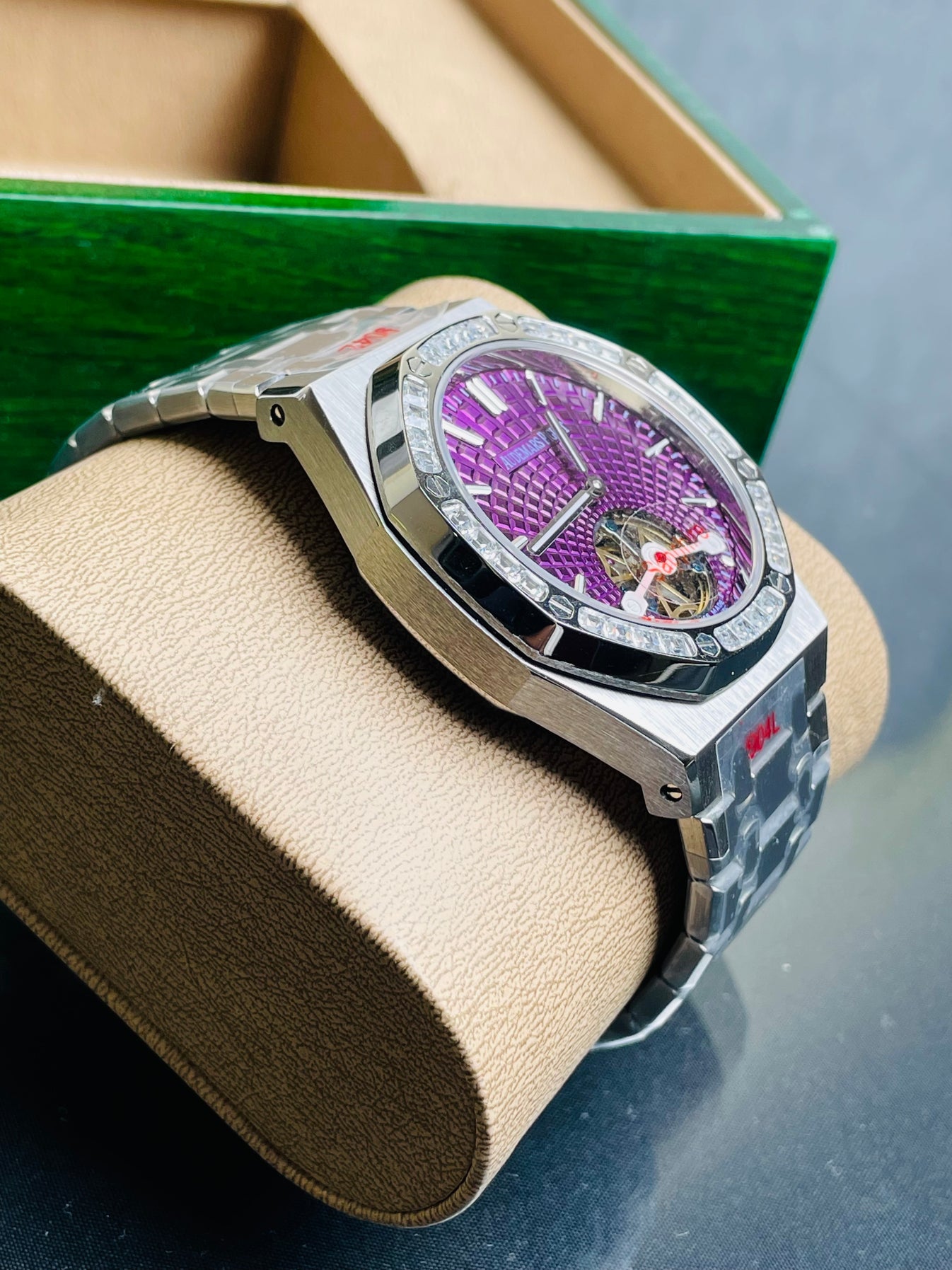 Audemars Piguet Royal Oak Selfwinding Flying Tourbillon features a purple "Plum" dial with a distinct sunburst tapisserie pattern.