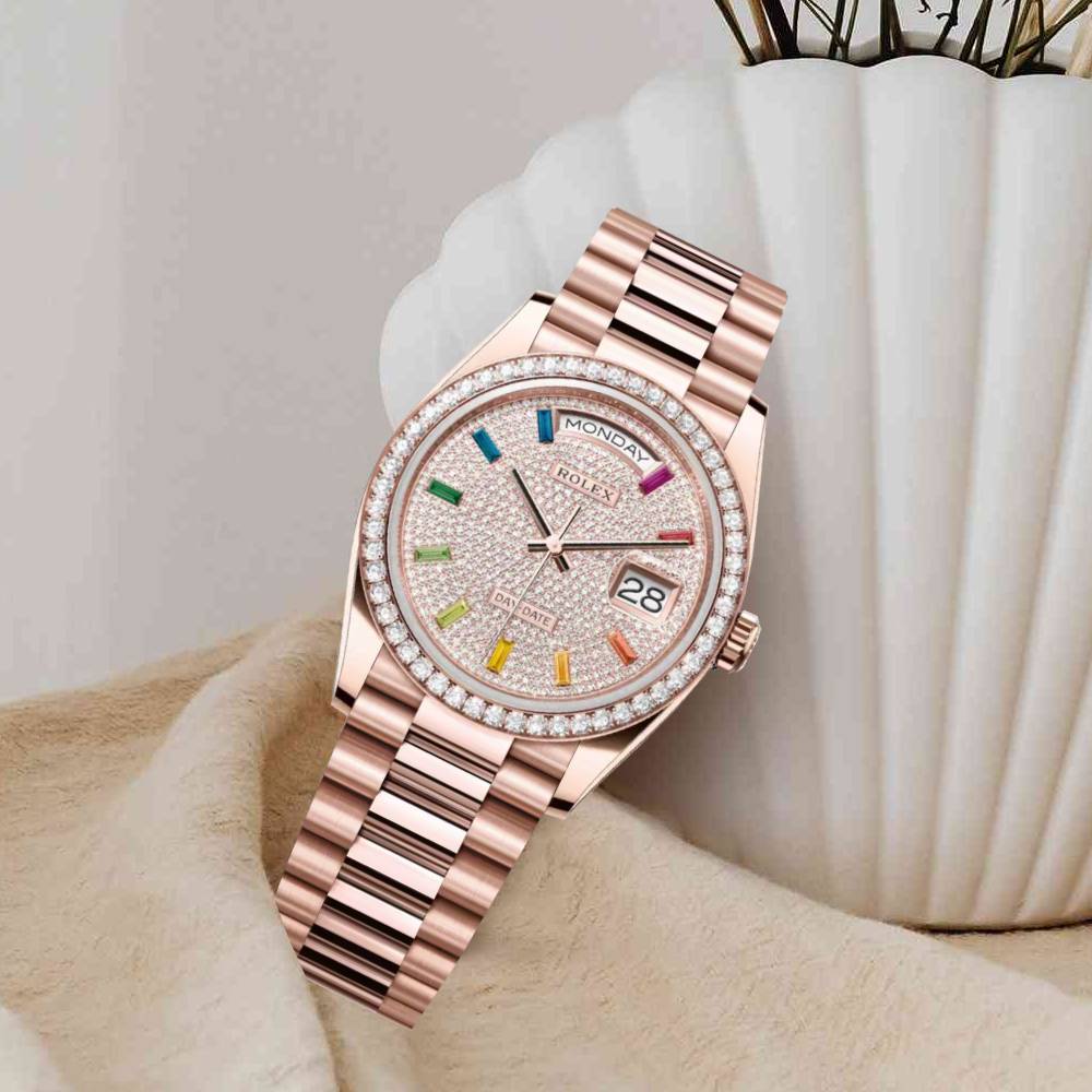 Rolex Day-Date 36mm in Everose gold features a diamond-paved dial with 10 rainbow-colored baguette-cut sapphire hour markers