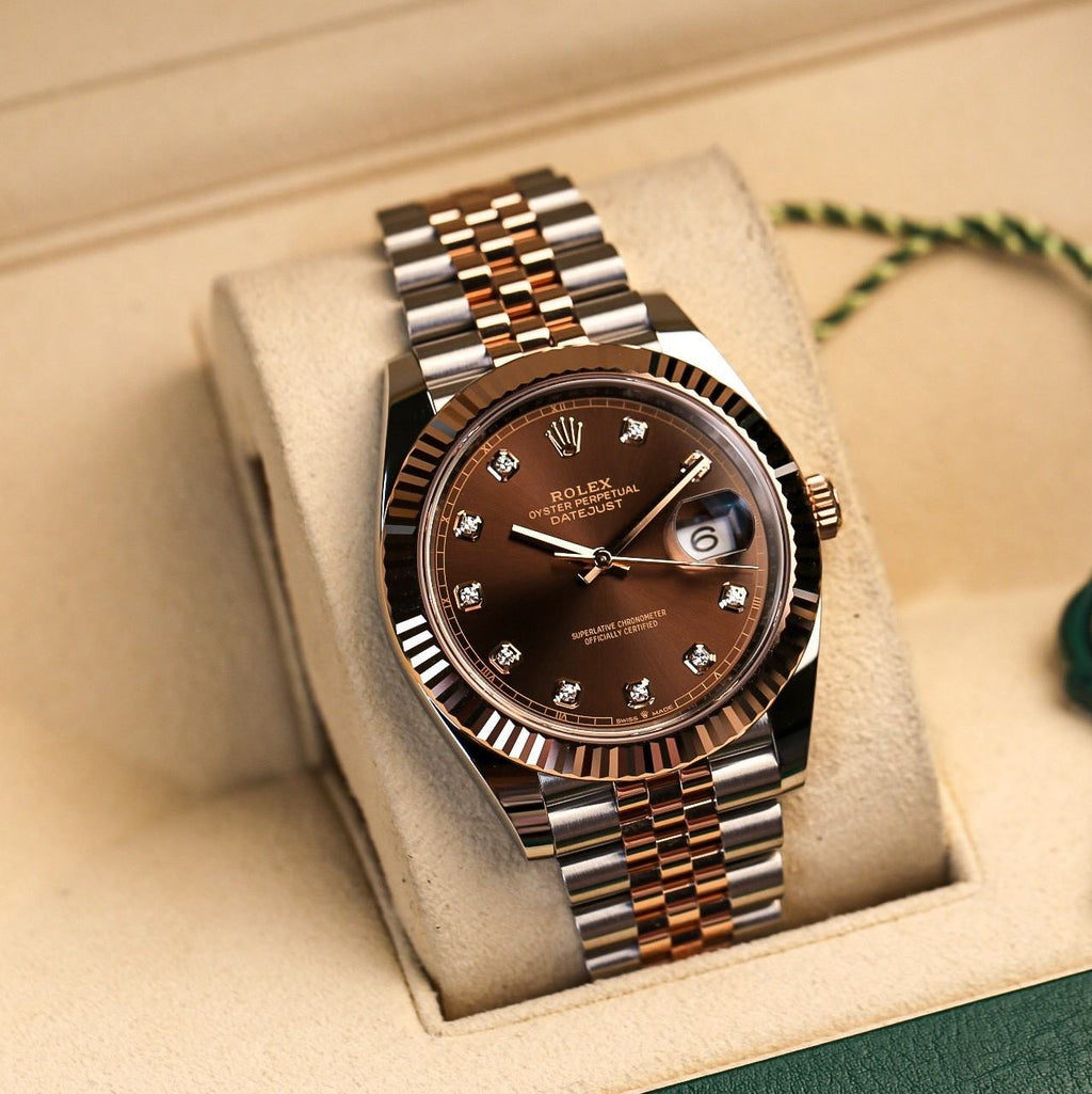 Rolex Datejust in Oystersteel and Everose gold, featuring a chocolate dial with diamond hour markers.