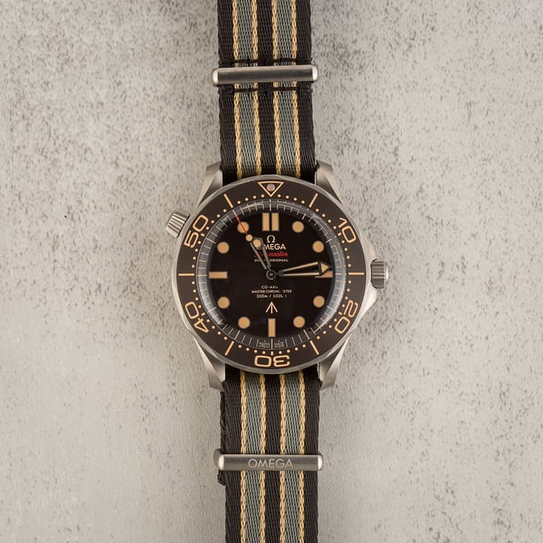 Omega Seamaster Diver 300M 007 Edition watch, featuring a lightweight titanium case and a tropical brown dial