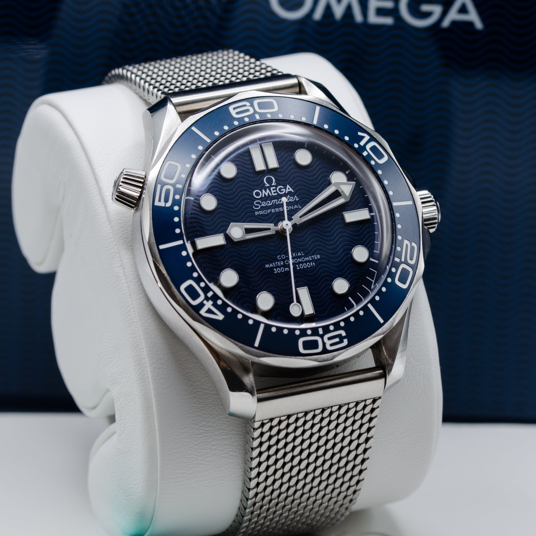 Omega Seamaster Diver 300M James Bond 60th Anniversary Watch with a laser-engraved blue wave dial