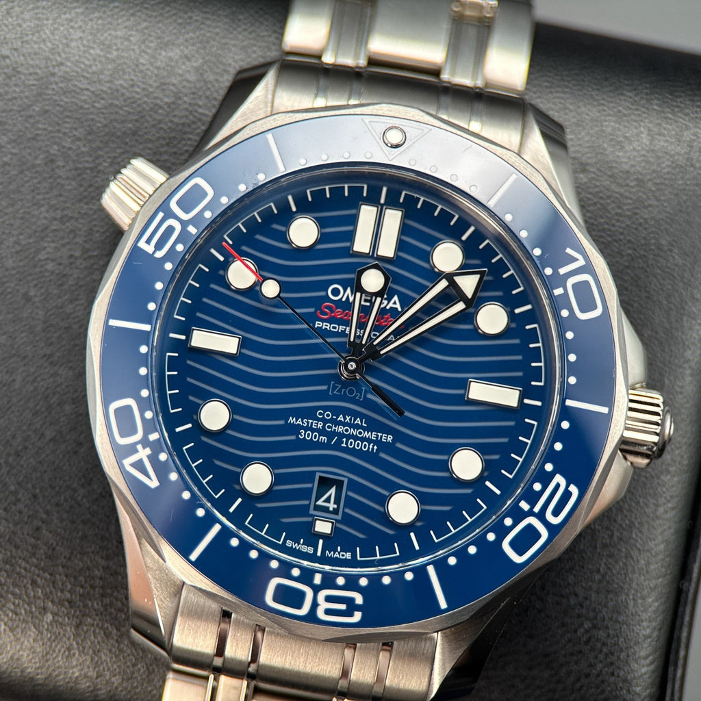 Omega Seamaster Diver 300M watch featuring a distinctive blue ceramic dial with wave patterns