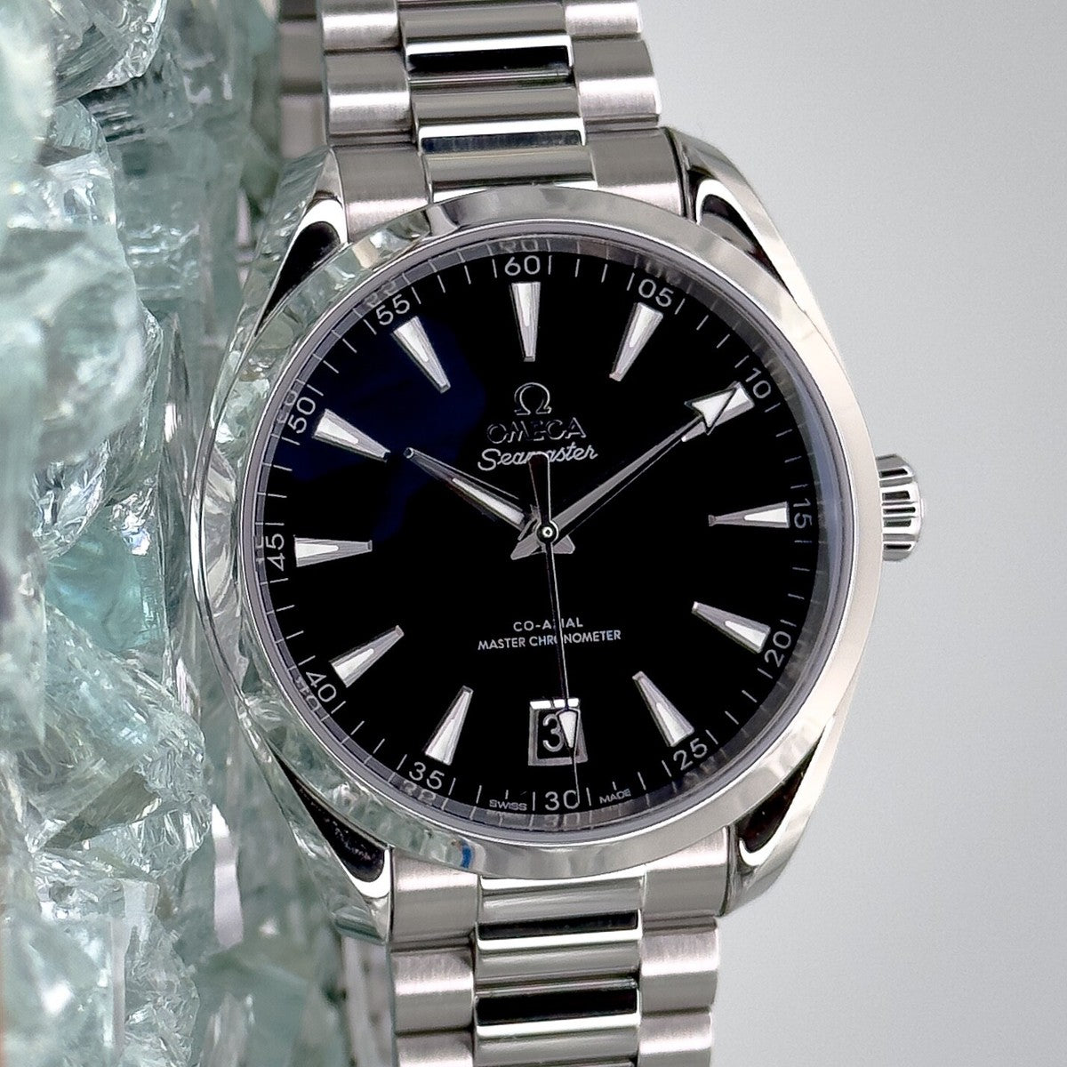 Omega Seamaster Aqua Terra 150M features a stainless steel case and a glossy black lacquered dial.