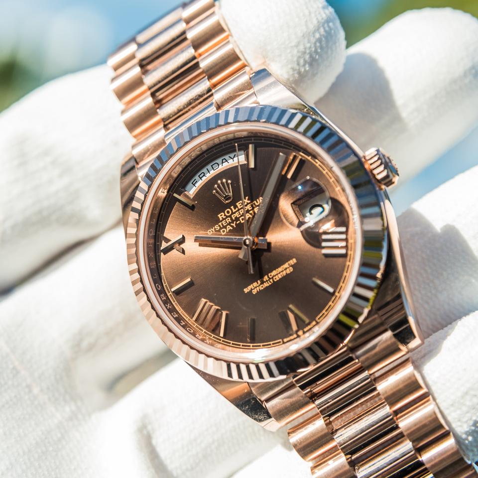 Rolex Day-Date crafted in Everose gold with a distinct chocolate sunray dial
