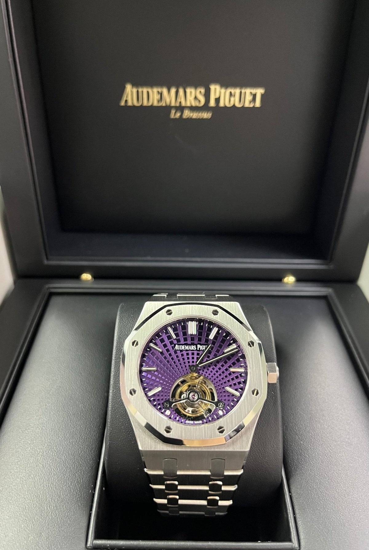Audemars Piguet Royal Oak Tourbillon Extra-Thin features a unique purple dial with a "Tapisserie Evolutive" sunburst pattern.