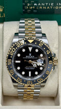 Rolex GMT-Master II in Oystersteel and yellow gold, featuring a black lacquered dial and a two-tone Jubilee bracelet
