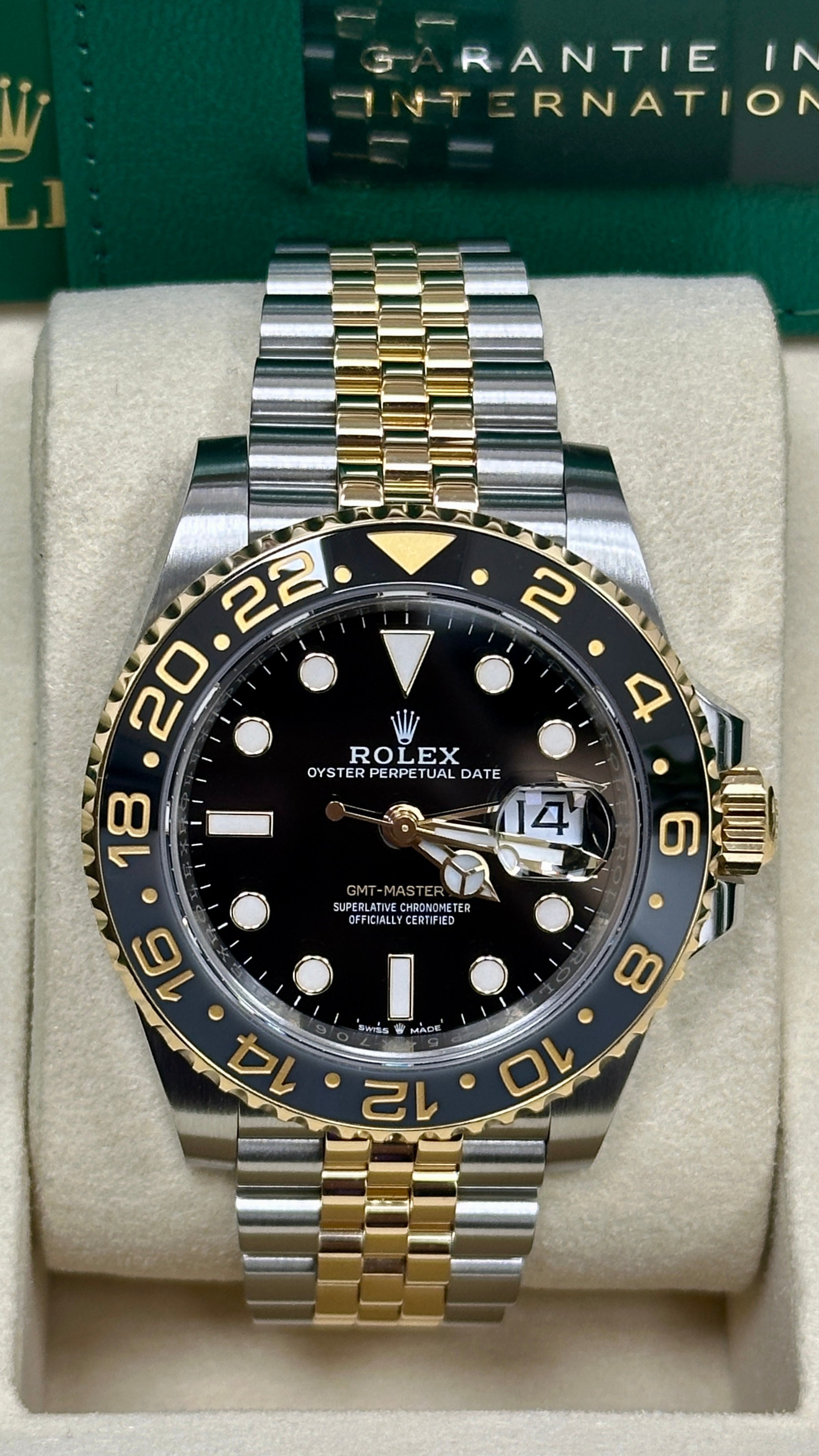Rolex GMT-Master II in Oystersteel and yellow gold, featuring a black lacquered dial and a two-tone Jubilee bracelet