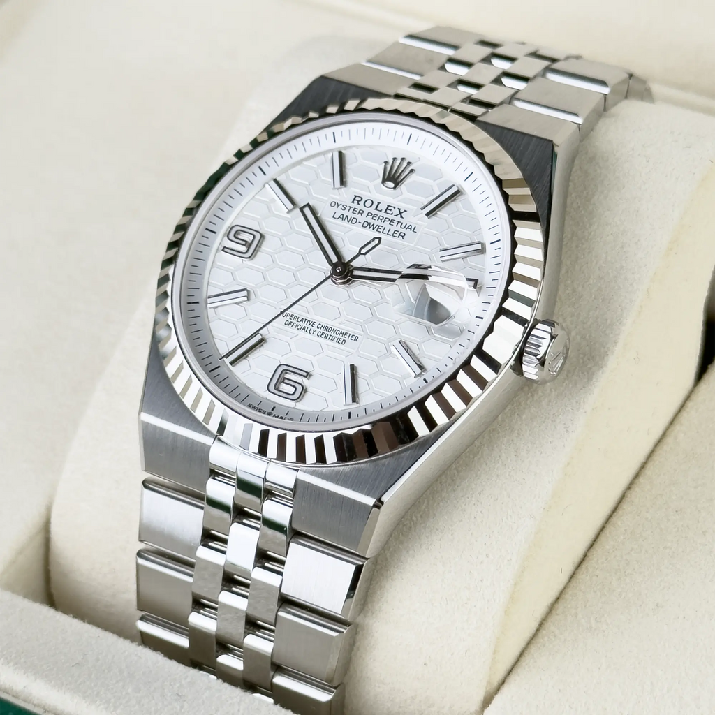 Rolex Land-Dweller features a distinctive white honeycomb motif dial and is paired with a stainless steel Jubilee bracelet
