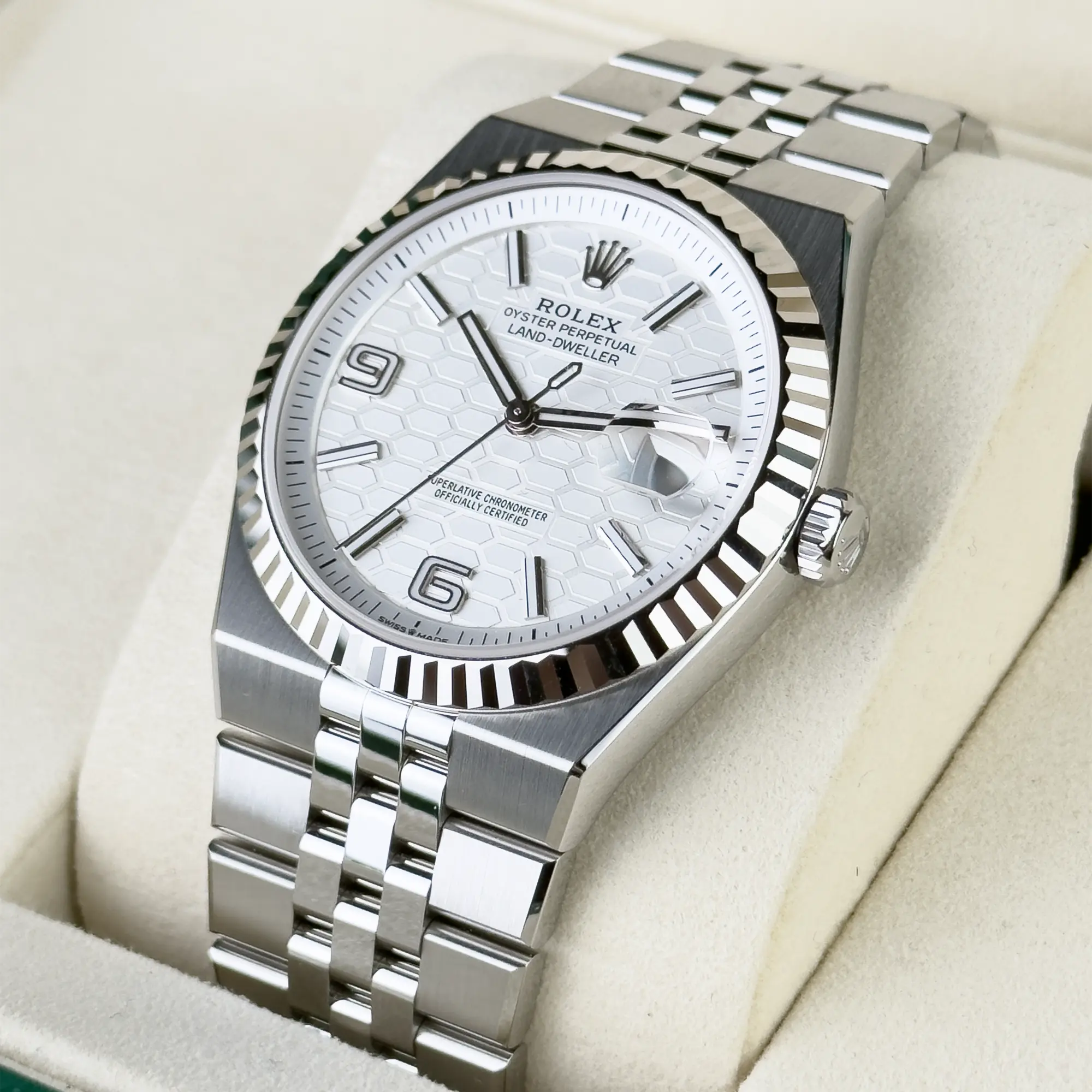 Rolex Land-Dweller features a distinctive white honeycomb motif dial and is paired with a stainless steel Jubilee bracelet