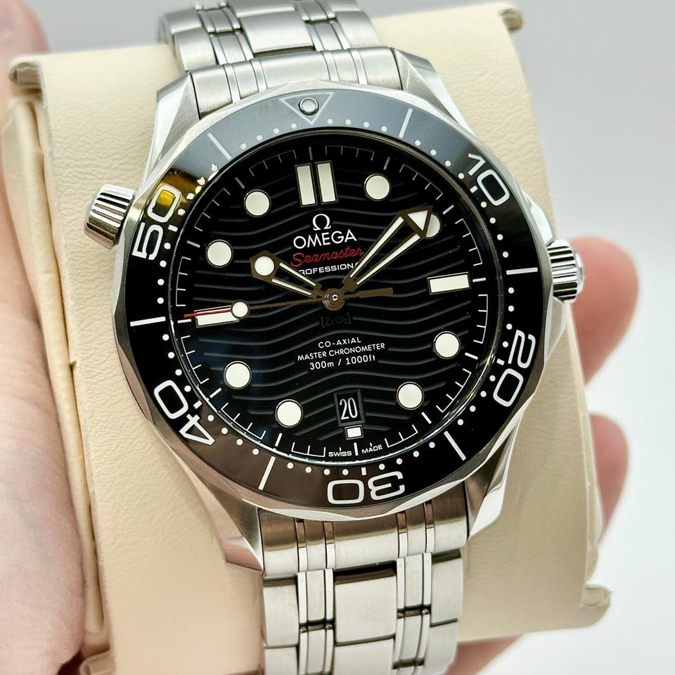 Omega Seamaster Diver 300M, distinguished by its black ceramic wave-patterned dial and stainless steel bracelet