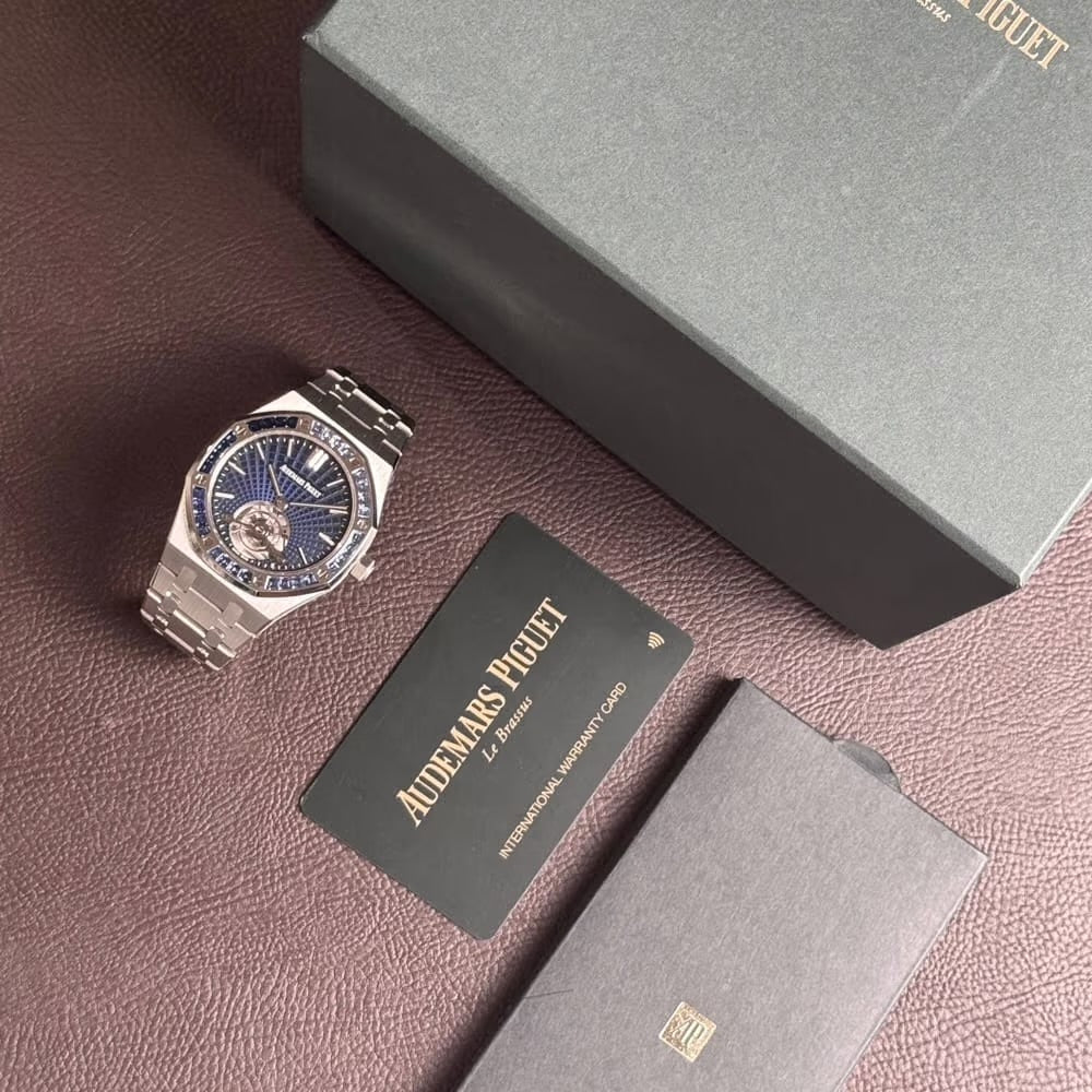 Audemars Piguet Royal Oak Tourbillon Extra-Thin features a platinum case and a bezel set with baguette-cut blue sapphires