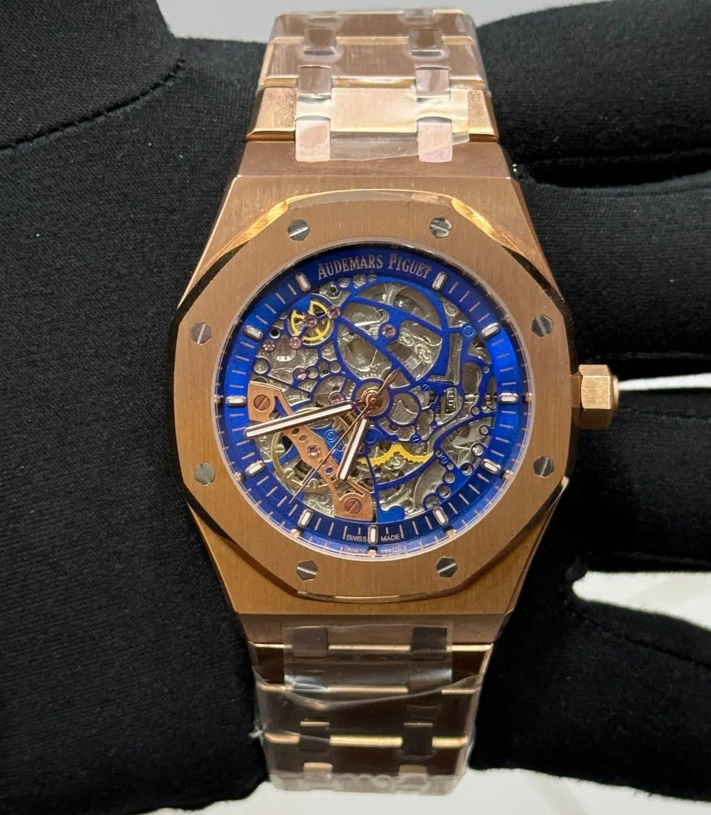 Audemars Piguet Royal Oak Openworked watch features a distinctive gold stainless steel octagonal bezel with visible screws and an intricate skeletonized dial.