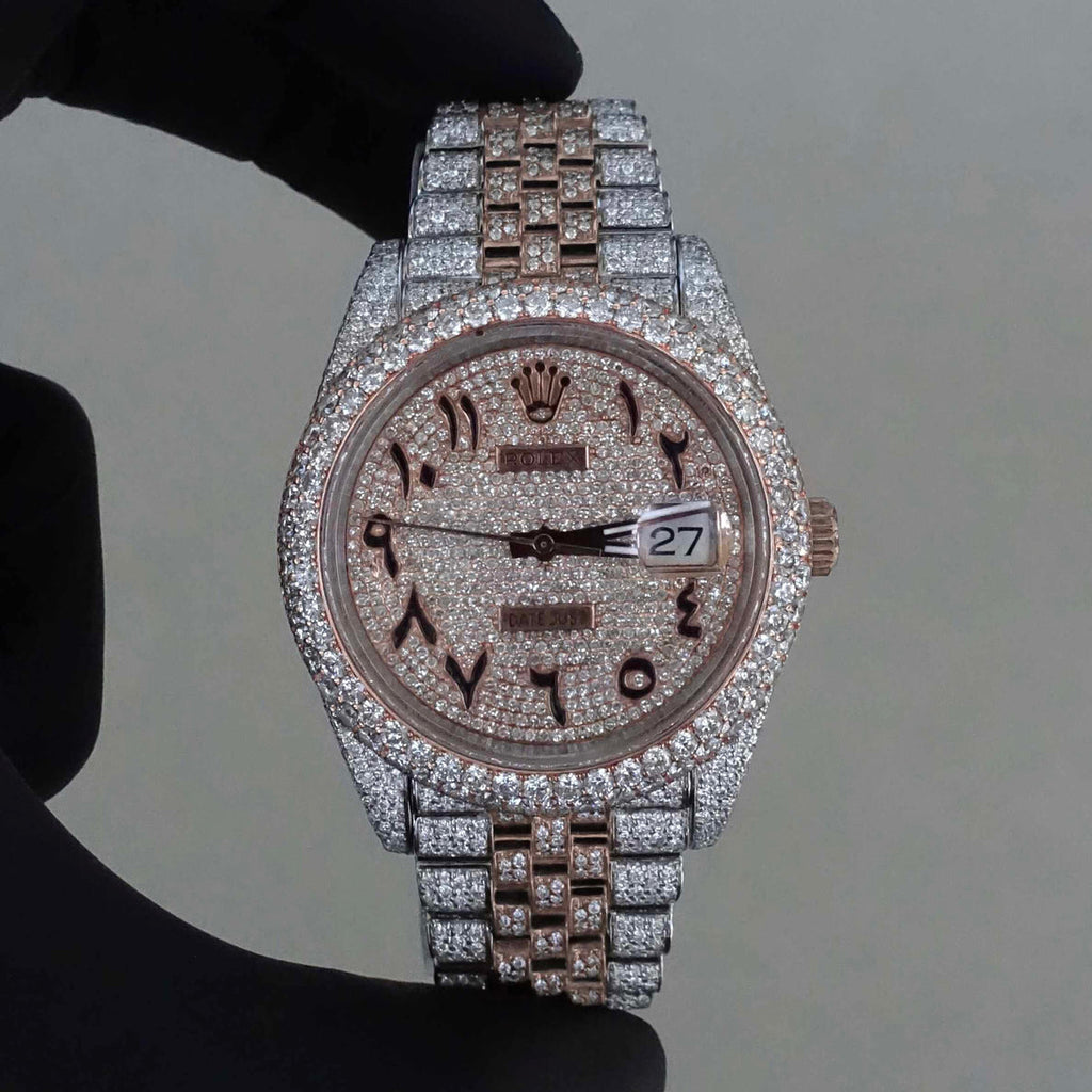 Rolex Datejust featuring a custom iced-out diamond dial with Arabic numerals and a full diamond-paved bezel and bracelet.