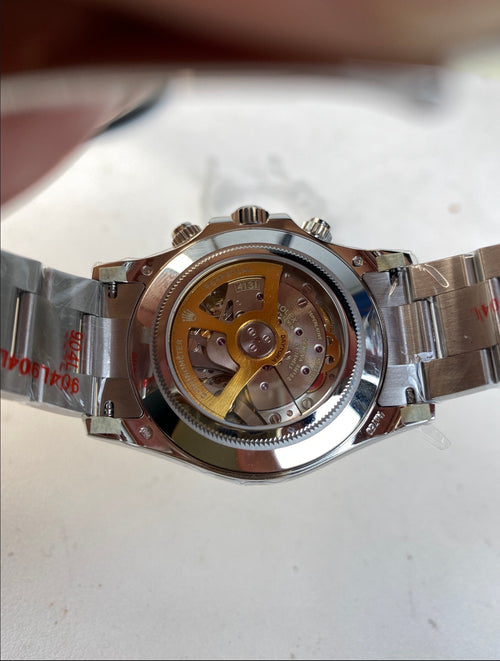 Rolex Cosmograph Daytona platinum in white gold featuring a black dial with diamond hour markers-unique exhibition caseback that showcases the every movement